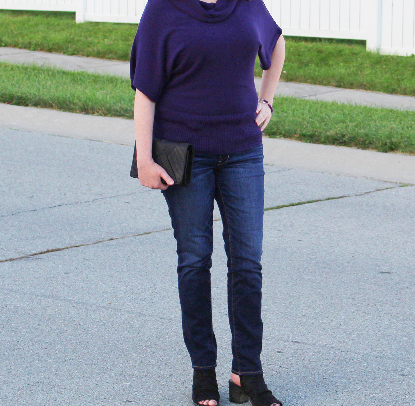 Sweater And Black Clutch