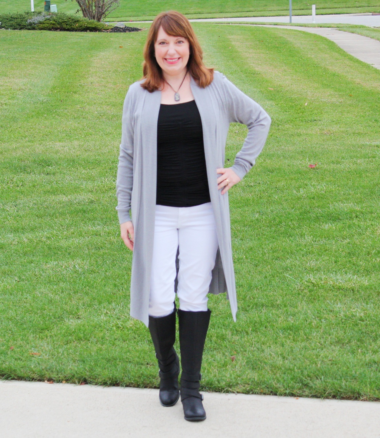 Gray Cardigan With Black Top, White Jeans, And Black Boots