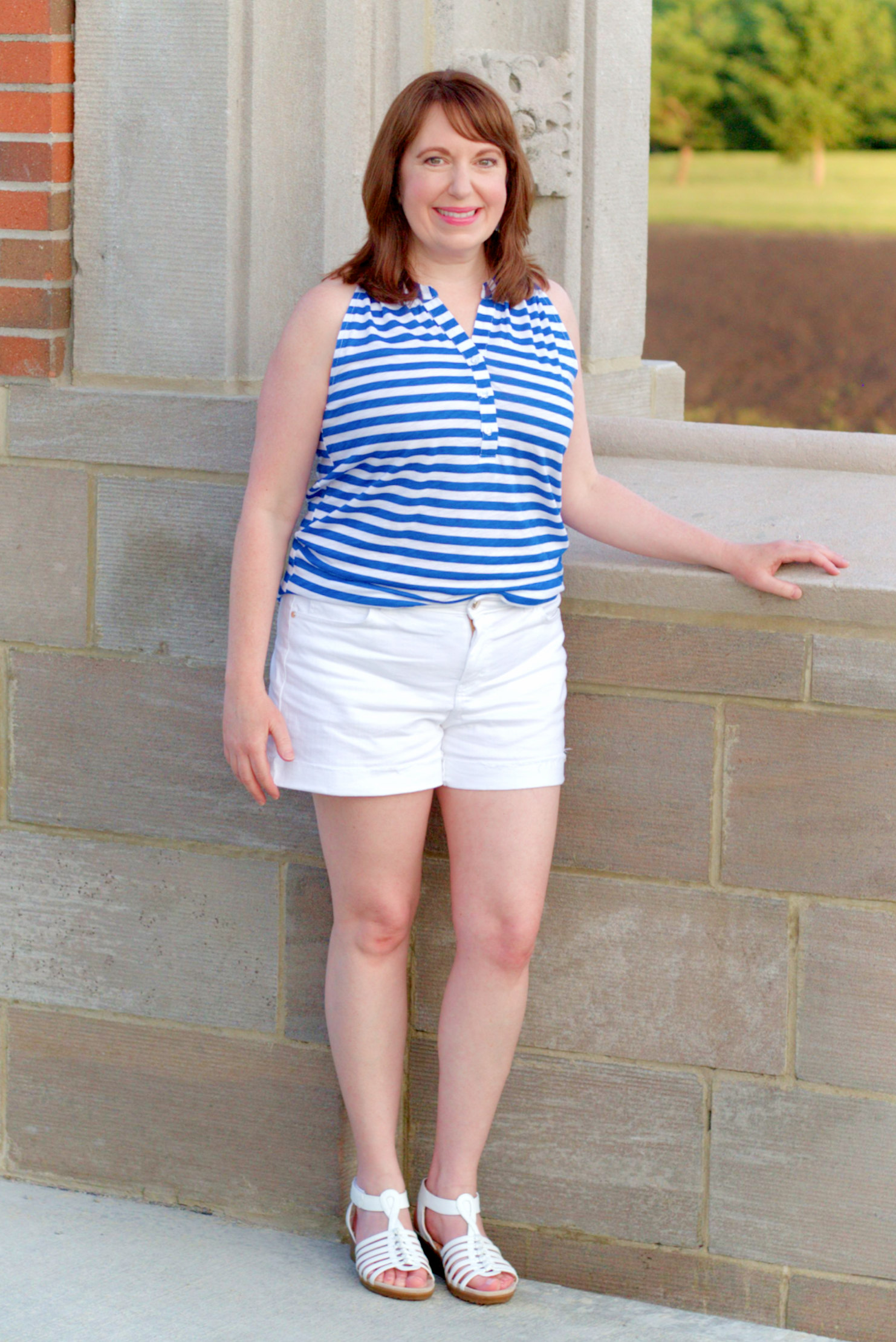 Dianna Wearing A Tank Top, White Shorts, And Sandals