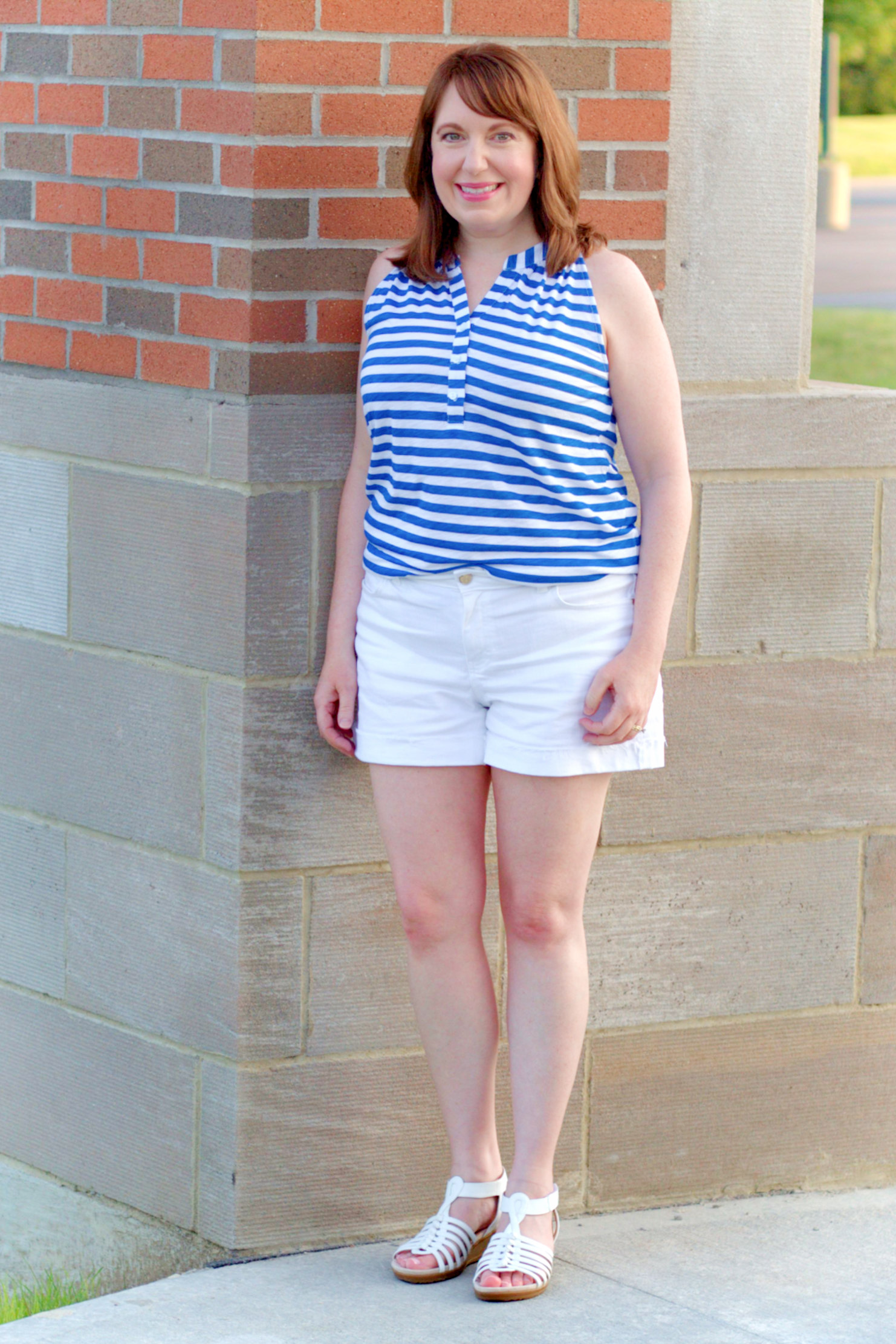 Dianna Standing By Brick & Stone Wall In Featured Outfit