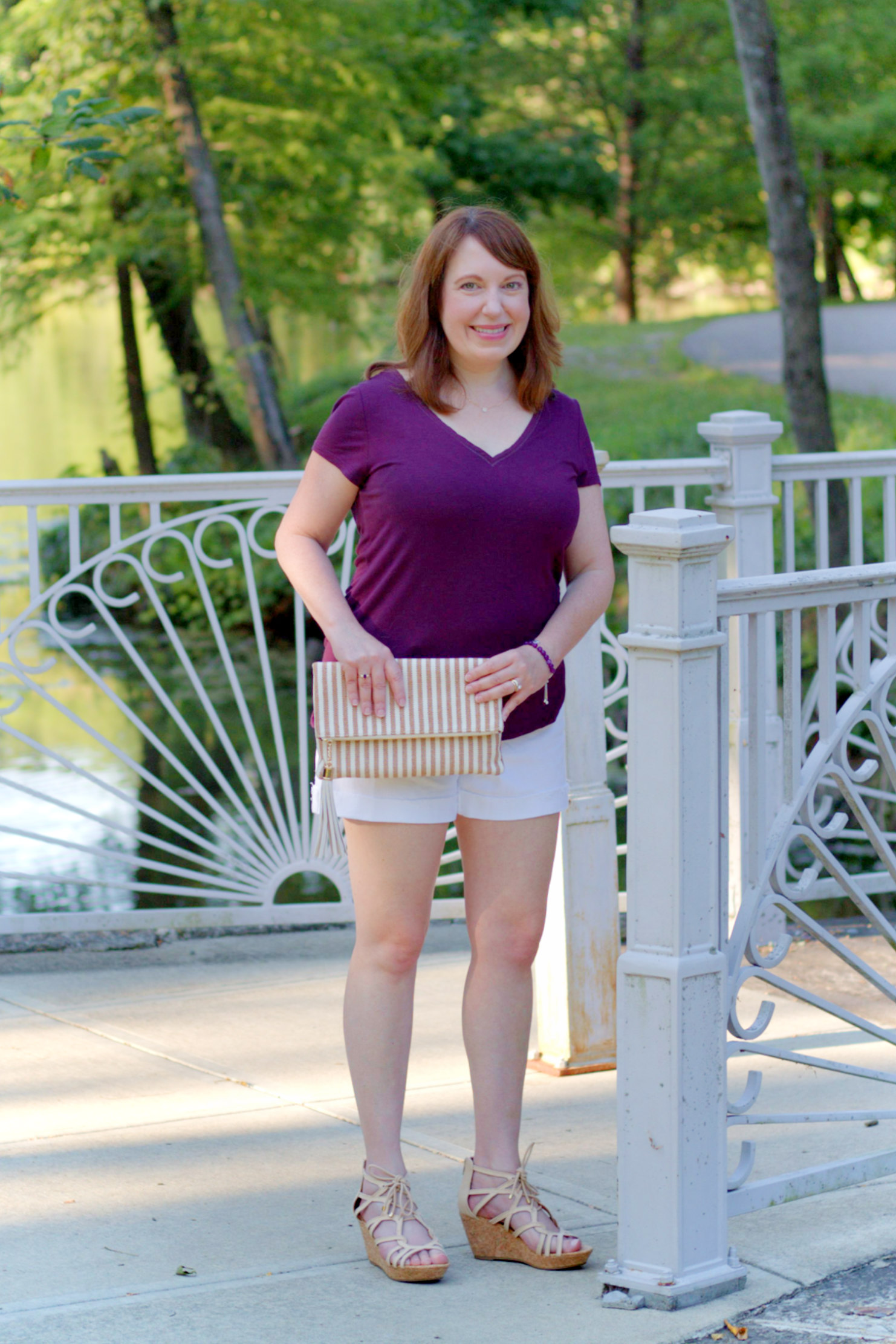 Purple Tee, White Shorts, & Stripped Clutch