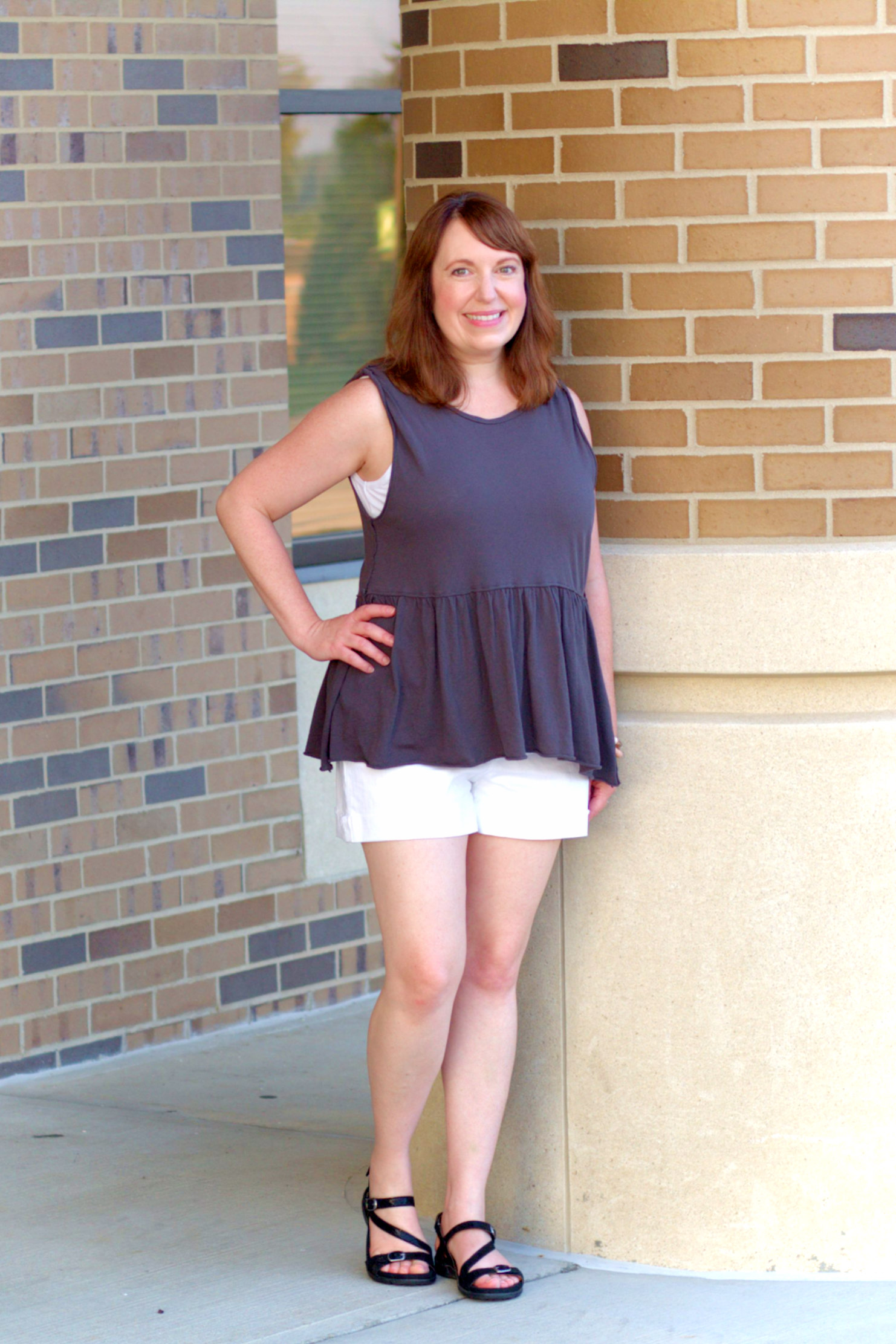 Grey Peplum Top, White Shorts, And Black Sandals
